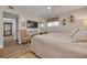 Spacious bedroom with ceiling fan, wood-look floors, and natural light at 1044 Charles St, Clearwater, FL 33755