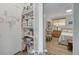 View into a bedroom showcasing wood floors, a decorative shelving unit, and dresser at 1044 Charles St, Clearwater, FL 33755
