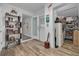 Welcoming entryway with wood-look floors and eclectic decor and storage space at 1044 Charles St, Clearwater, FL 33755
