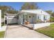 Charming single-story home with a cozy porch, updated features, and inviting curb appeal at 1044 Charles St, Clearwater, FL 33755
