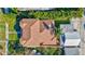 Overhead view of a well-maintained house with lush landscaping and a brown shingled roof at 1160 26Th N Ave, St Petersburg, FL 33704