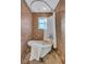 Vintage-style bathroom with a clawfoot tub and classic tilework, creating a luxurious spa experience at 1160 26Th N Ave, St Petersburg, FL 33704