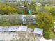 Drone shot showcasing mature landscaping around the complex with convenient parking at 11800 Park Blvd # 505, Seminole, FL 33772