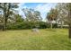 Serene backyard setting with a white picnic table, perfect for outdoor dining and relaxation at 11800 Park Blvd # 505, Seminole, FL 33772