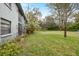Expansive backyard featuring lush greenery, mature trees, and space for outdoor activities at 11800 Park Blvd # 505, Seminole, FL 33772