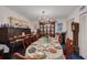 Formal dining room featuring a large table set for a feast and classic wooden furniture at 11800 Park Blvd # 505, Seminole, FL 33772