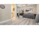 This is the bedroom that features a ceiling fan, art, and a door to the ensuite bathroom at 11930 Perennial Pl, Bradenton, FL 34211