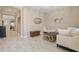 Inviting living room with tile floors, neutral paint, a decorative mirror, and an open concept design at 11930 Perennial Pl, Bradenton, FL 34211