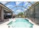 A large in-ground pool is surrounded by a screened enclosure for endless hours of fun at 11930 Perennial Pl, Bradenton, FL 34211