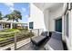 Relaxing balcony with chaise lounges overlooks manicured landscaping and walkway at 1209 E Cumberland Ave # 502, Tampa, FL 33602