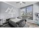 Modern bedroom features a large window, gray color palette, and unique wall decor at 1209 E Cumberland Ave # 502, Tampa, FL 33602