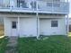 View of a two-story house with a door, window and siding on the lower level at 13253 Boca Ciega Ave, Madeira Beach, FL 33708