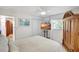 Bright bedroom with white walls and a large armoire at 1389 47Th Ne Ave, St Petersburg, FL 33703