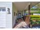 Inviting brick entrance with a blue glass front door, brick wall, and covered entryway at 1389 47Th Ne Ave, St Petersburg, FL 33703