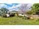 Well-maintained home with a green lawn and a beautiful array of trees and plants at 1389 47Th Ne Ave, St Petersburg, FL 33703