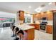 Kitchen with sleek countertops, wooden cabinets, and modern appliances at 1389 47Th Ne Ave, St Petersburg, FL 33703