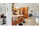 Bright kitchen with a breakfast bar that includes seating for three and stainless steel appliances at 1389 47Th Ne Ave, St Petersburg, FL 33703