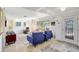 Bright living room with tile flooring, large windows, and modern furniture at 1389 47Th Ne Ave, St Petersburg, FL 33703