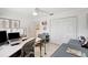 Functional home office space with a large desk, ample storage, and bright lighting at 1389 47Th Ne Ave, St Petersburg, FL 33703