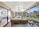 Screened patio overlooking canal and pool, furnished with a comfortable seating area at 1389 47Th Ne Ave, St Petersburg, FL 33703