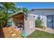 Exterior shed shows access to pool equipment, next to the exterior of the home at 1389 47Th Ne Ave, St Petersburg, FL 33703