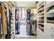 Spacious walk-in closet with custom shelving, drawers, and hanging storage at 1389 47Th Ne Ave, St Petersburg, FL 33703