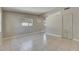 Bright living room featuring neutral walls, tile floors, and natural light from updated windows creating a welcoming atmosphere at 1416 55Th N Ave, St Petersburg, FL 33703