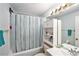 Bathroom with a shower and tub combo and built-in storage at 15 Emerald Bay Dr, Oldsmar, FL 34677