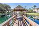 Picturesque gazebo over a pond with a fountain and lush landscaping at 15 Emerald Bay Dr, Oldsmar, FL 34677