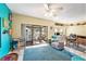 Inviting living room with a view to the outdoors from a sliding glass door and a dining area at 15 Emerald Bay Dr, Oldsmar, FL 34677