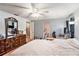 Spacious main bedroom offering a dresser, and an adjoining bathroom at 15 Emerald Bay Dr, Oldsmar, FL 34677