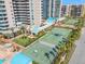 Stunning aerial view showcasing the building amenities, including tennis and basketball courts at 1560 Gulf Blvd # 1202, Clearwater Beach, FL 33767