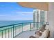 Cozy balcony with seating, overlooking the beach and ocean, perfect for enjoying the coastal scenery at 1560 Gulf Blvd # 1202, Clearwater Beach, FL 33767