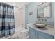 Bathroom with a shower-tub combo, updated vanity, attractive countertop, and unique glass vessel sink at 1560 Gulf Blvd # 1202, Clearwater Beach, FL 33767