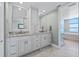 Bright bathroom with double sink vanity and tiled floors at 1560 Gulf Blvd # 1202, Clearwater Beach, FL 33767