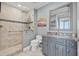 Beautiful bathroom featuring a glass shower, granite vanity with gray cabinetry, and neutral walls at 1560 Gulf Blvd # 1202, Clearwater Beach, FL 33767