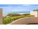 Beautiful beach view with sandy beach, blue skies and light surf visible from the condo at 1560 Gulf Blvd # 1202, Clearwater Beach, FL 33767