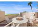 Outdoor fire pit with comfortable seating perfect for entertaining with beautiful ocean view at 1560 Gulf Blvd # 1202, Clearwater Beach, FL 33767