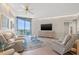 Cozy living room featuring neutral paint, recessed lighting, and glass doors to the outside at 1560 Gulf Blvd # 1202, Clearwater Beach, FL 33767