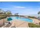 Community pool and hot tub overlooking a wide sandy beach and ocean at 1560 Gulf Blvd # 1202, Clearwater Beach, FL 33767