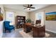 Functional office space featuring a large desk, bookcase, and comfortable seating at 16388 Cape Horn Blvd, Punta Gorda, FL 33955