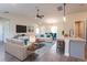 Open-concept living room with tile floors, comfortable seating, and a dining area at 16388 Cape Horn Blvd, Punta Gorda, FL 33955