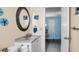 Well-lit bathroom showcasing a vanity and a glimpse into the bedroom at 1662 S Lake Ave # 2, Clearwater, FL 33756