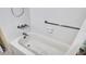 Bright white bathroom showing a clean and functional bathtub and shower at 1662 S Lake Ave # 2, Clearwater, FL 33756