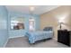 Cozy bedroom featuring blue walls and tile floors at 1662 S Lake Ave # 2, Clearwater, FL 33756