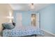Bright bedroom showcasing the coastal decor and neutral paint scheme at 1662 S Lake Ave # 2, Clearwater, FL 33756