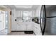 Functional kitchen featuring white cabinets and appliances at 1662 S Lake Ave # 2, Clearwater, FL 33756