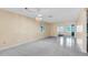 This living room is bright and open with tile flooring and an adjacent entry way at 1662 S Lake Ave # 2, Clearwater, FL 33756