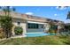The patio offers green grass and a neutral colored home in the background at 1662 S Lake Ave # 2, Clearwater, FL 33756