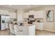 Beautiful kitchen with stainless steel appliances, granite countertops and an island with chairs at 17061 James Trl, Parrish, FL 34219